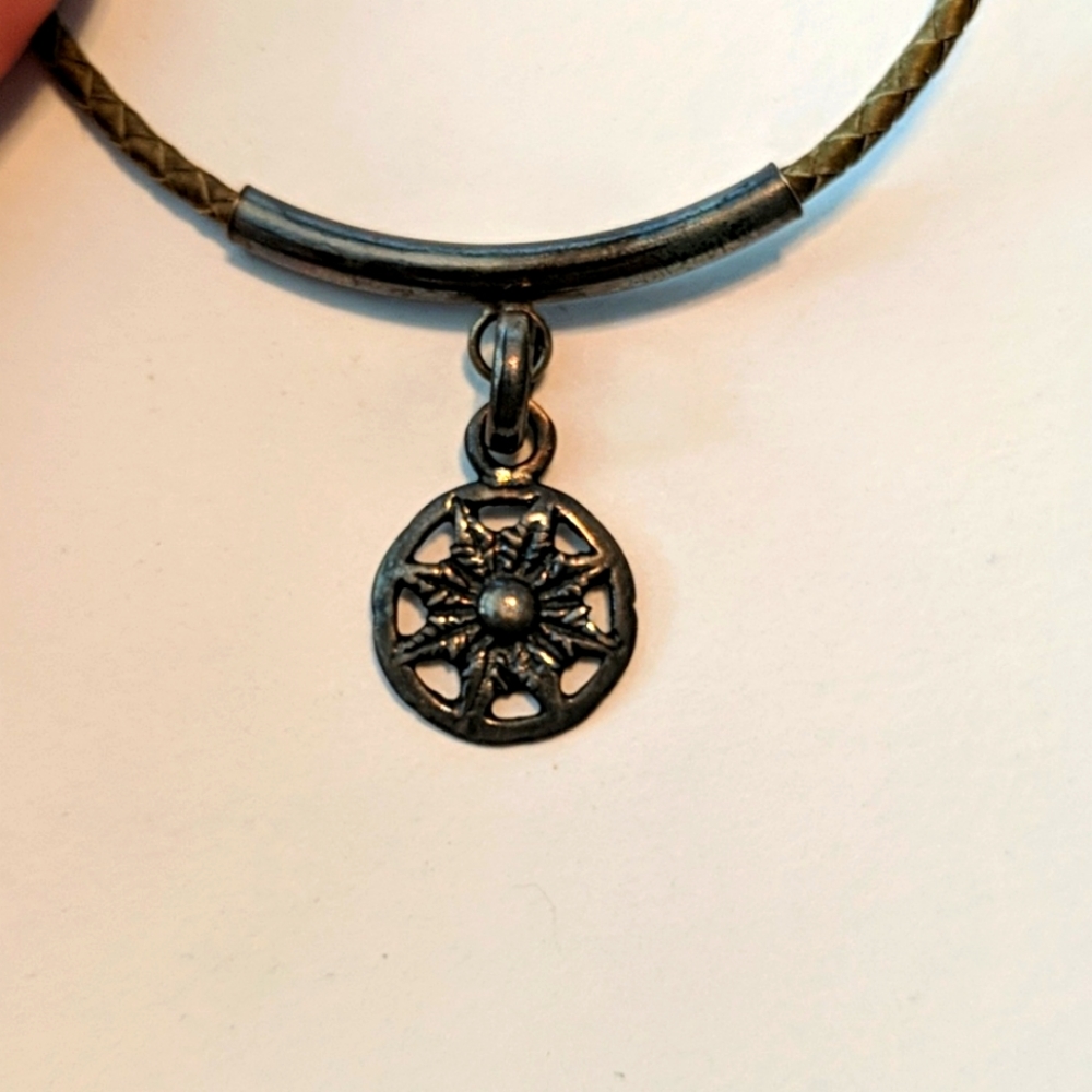 Flower medallion on braided leather